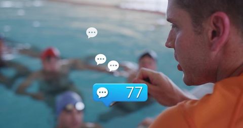 Swim Coach Pointing at Group of Swimmers with Digital Chat Notification '77' Overlay