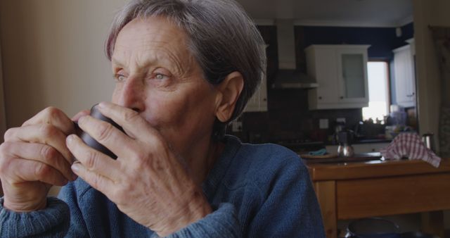 Senior Woman Drinking Coffee in Cozy Kitchen - Download Free Stock Images Pikwizard.com