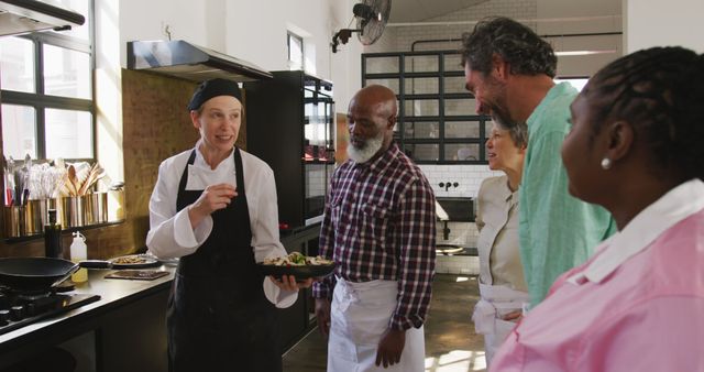 Chef Teaching Cooking Class with Diverse Group in Modern Kitchen - Download Free Stock Images Pikwizard.com