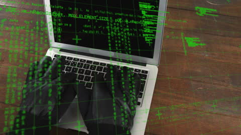 Cybersecurity Concept with Hacker Typing on Laptop with Green Code Overlay