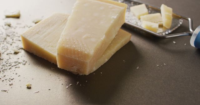 Blocks of Parmesan Cheese with Grater on Countertop - Download Free Stock Images Pikwizard.com