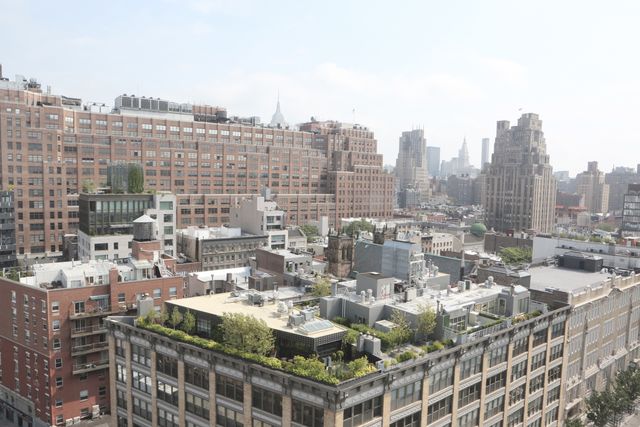 This urban view captures an aerial perspective of a city with a mix of modern high-rise buildings and rooftops adorned with greenery. Ideal for website headers, environmental blogs, real estate advertisements, or urban planning presentations. Showcases urban coexistence of nature and architecture.