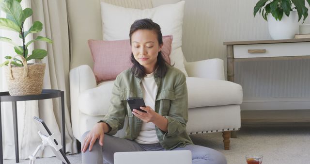 Young Woman Focused on Smartphone While Working from Home - Download Free Stock Images Pikwizard.com