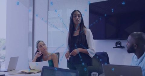 Businesswoman Presenting with Data Visualization at Modern Office Meeting