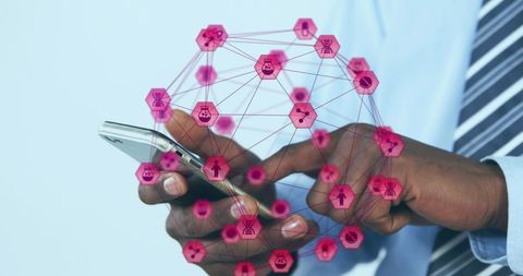 Businessman Interacting with Mobile Phone and Technology Elements