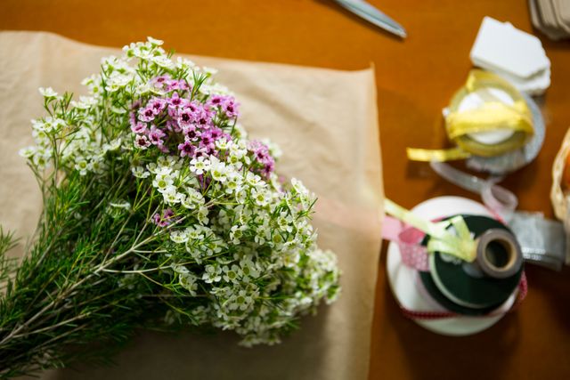 Close-Up of flowers on the wooden worktop at his flower shop