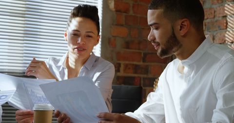 Professionals reviewing documents in modern office setting