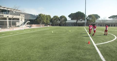 Teen Soccer Players Practicing Team Drills on Sunny School Field - Download Free Stock Images Pikwizard.com