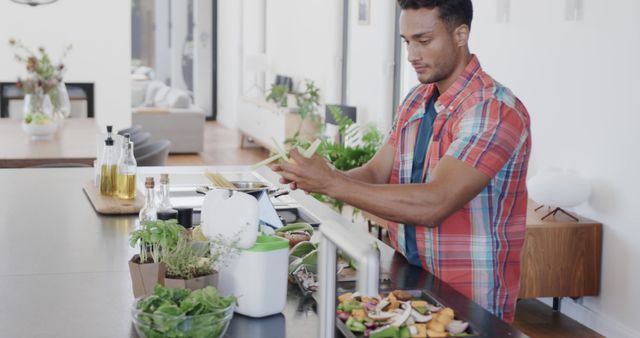 Young Man Preparing Healthy Food in Modern Kitchen - Download Free Stock Images Pikwizard.com