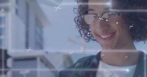 Curly student tapping smartphone, checking email with tech overlays and urban outdoor smile