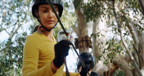 Young Woman Preparing for Outdoor Adventure with Safety Gear