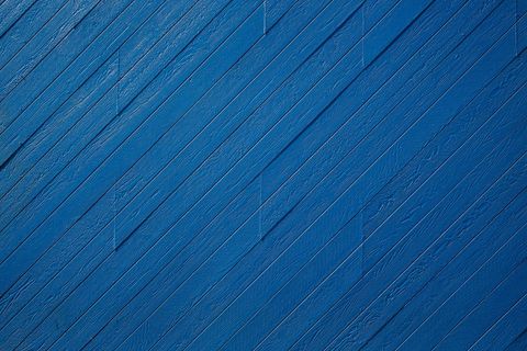 Vivid Diagonal Blue Wooden Planks Texture Creating Modern Backdrop for Design Projects