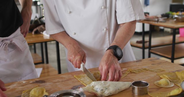 Chef kneading dough and filling pasta with a piping bag - Download Free Stock Images Pikwizard.com