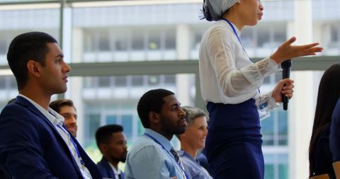 Confident Businesswoman Speaking at Corporate Seminar - Download Free Stock Images Pikwizard.com