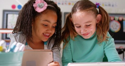 Diverse School Children Engaged with Tablet Technology in Classroom - Download Free Stock Images Pikwizard.com