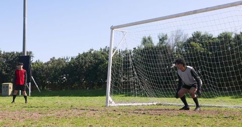 Soccer Players Practicing Near Goal: Experience Teamwork and Strategy in Action