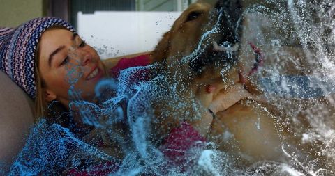 Woman enjoying cozy moment with golden retriever and digital effects
