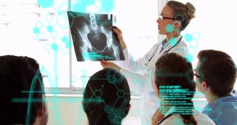Medical Professionals Analyzing X-Ray with Data Overlays - Download Free Stock Images Pikwizard.com