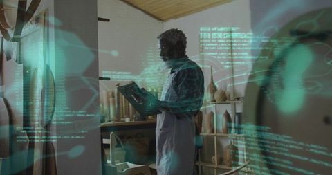 Artisan woodworker using tablet with augmented reality overlay inspecting wooden vessels