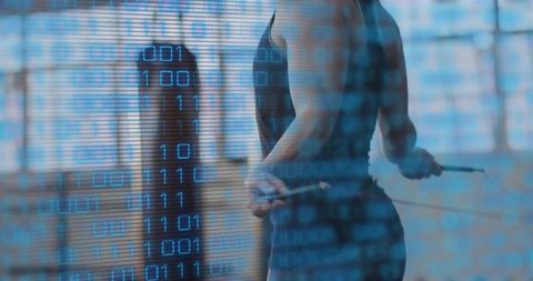 Female athlete jumping rope in industrial gym with binary code overlay for digital fitness