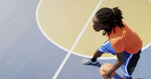 Focused Basketball Player Dribbling on Outdoor Court - Download Free Stock Images Pikwizard.com
