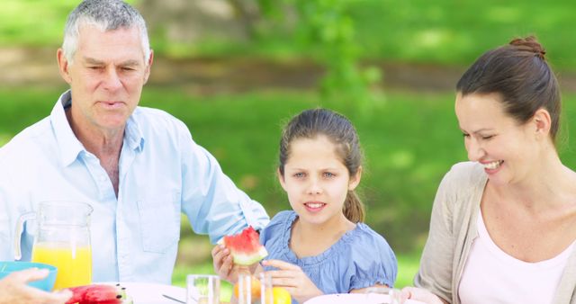 Three Generations Outdoor Family Picnic Enjoying Watermelon On A Bright Summer Day - Download Free Stock Images Pikwizard.com