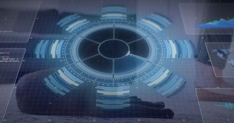 Circular holographic hud projecting data overlay on reflective desk with hand