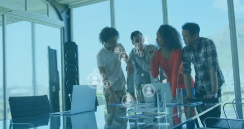 Diverse Team Engaging With Digital Data Overlay in Modern Office