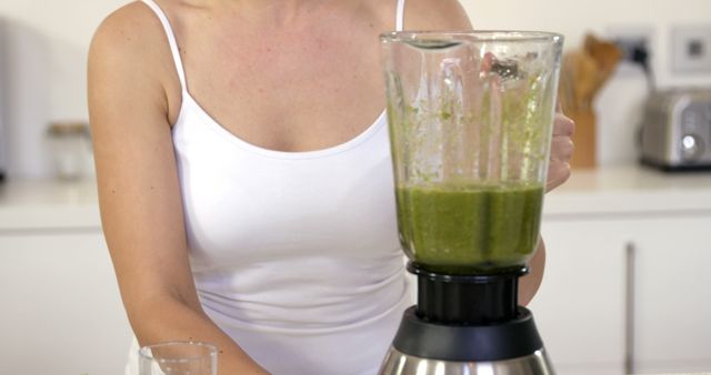 Woman Blending Green Smoothie in Home Kitchen - Download Free Stock Images Pikwizard.com