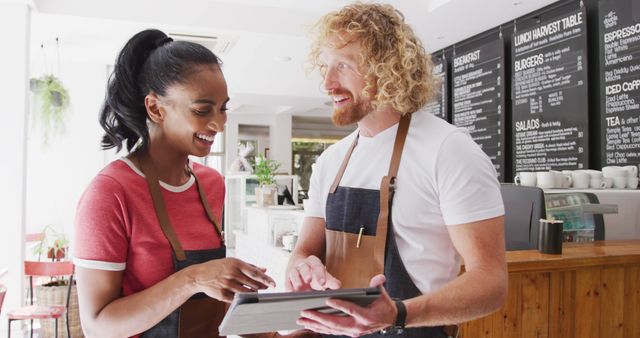 Diverse cafe staff using tablet for service order management - Download Free Stock Images Pikwizard.com