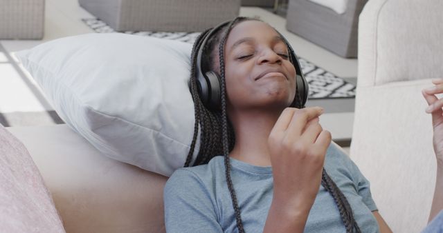 Young Girl Relaxing with Headphones - Download Free Stock Images Pikwizard.com