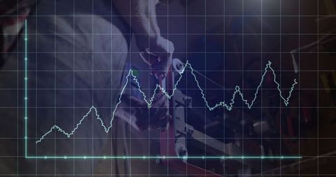 Mechanic Adjusting Vise Bolt with Overlaid Line Graph in Workshop