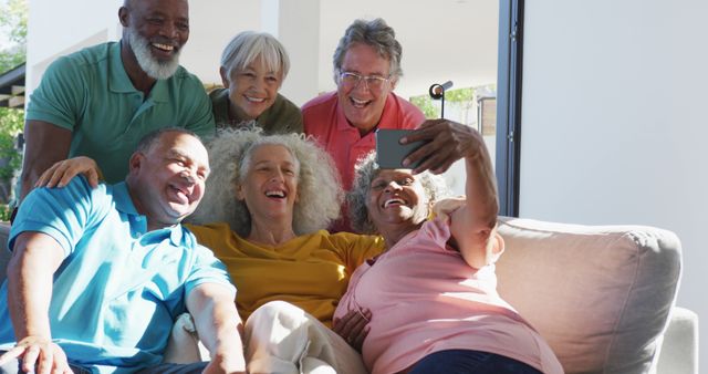 Group of Seniors Sitting on Couch and Taking a Selfie Together - Download Free Stock Images Pikwizard.com