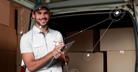 Smiling Delivery Person Using Tablet for Inventory Management