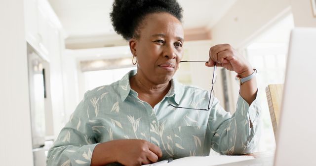 Senior Woman Working from Home on Laptop, Focused and Confident - Download Free Stock Images Pikwizard.com