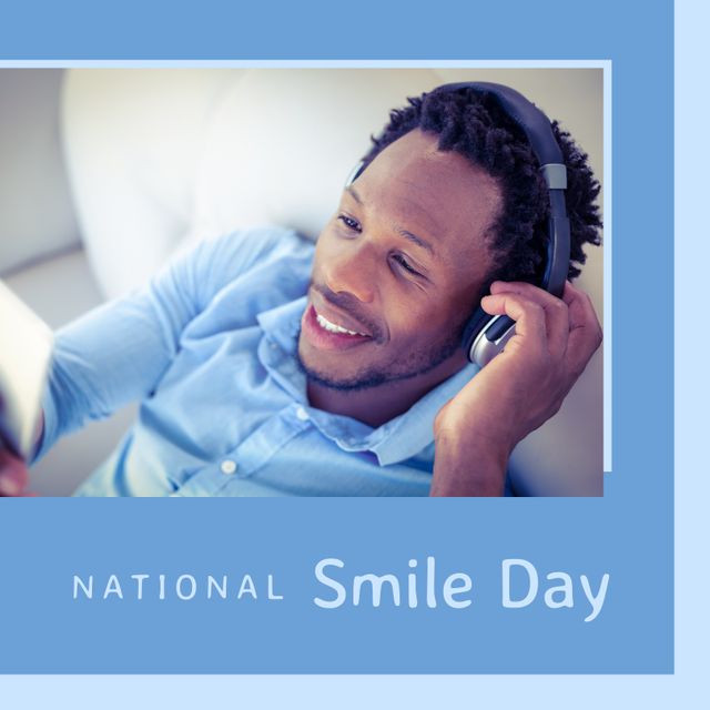 National Smile Day is depicted with an African American man smiling while listening to music with headphones. This stock image can be used for social media campaigns, promoting positive mental health, advertisements for leisure or relaxation products, and articles about celebrating special days.