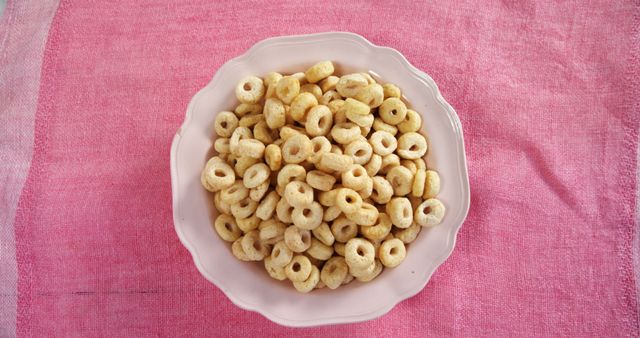 Bowl of Cereal Rings on Pink Tablecloth - Download Free Stock Images Pikwizard.com