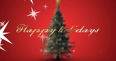Golden happy holidays script over blurred christmas tree on red background with starbursts