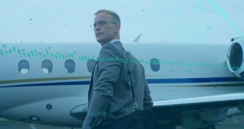 Businessman Near Private Jet with Overlayed Graph Elements - Download Free Stock Images Pikwizard.com