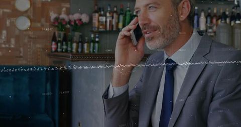 Executive talking on smartphone in lounge with data waveform overlay and copy space