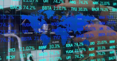 Global finance dashboard overlaying office workspace with analyst adjusting equipment