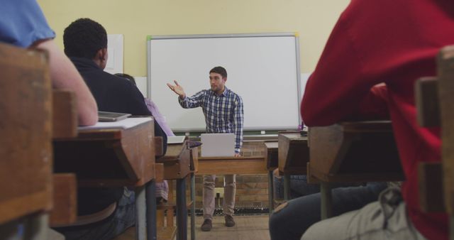 Teacher Conducting Lesson with Students in Traditional Classroom Setting - Download Free Stock Images Pikwizard.com