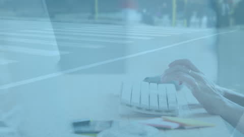 Digital Technology Concept Blending Hand Typing with Urban Street Overlay