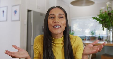 Happy Woman Making Video Call in Modern Kitchen