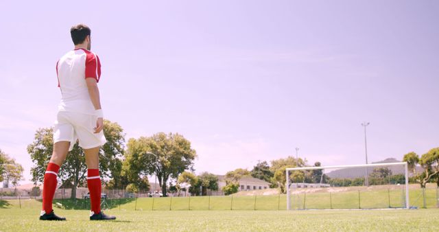 Soccer Player Preparing for Penalty Kick in Sunny Field - Download Free Stock Images Pikwizard.com