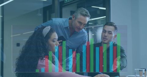 Diverse Team Analyzing Business Charts in Office Setting