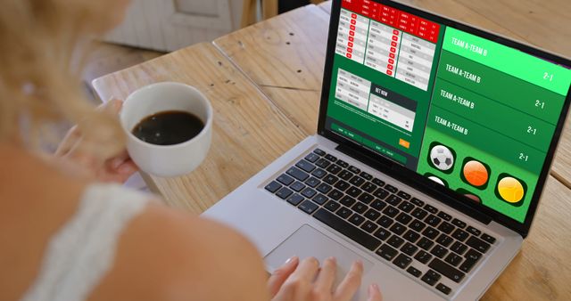 Woman Engaged in Online Sports Betting with Coffee - Download Free Stock Images Pikwizard.com