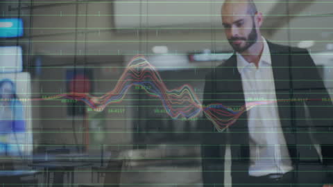Businessman Engaging with Financial Graphs and Data