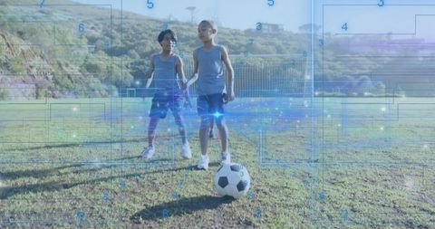 Boys Playing Soccer with Futuristic Digital Overlays on Grass Field