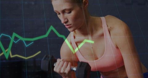 Woman analyzing fitness metrics during bicep curl workout